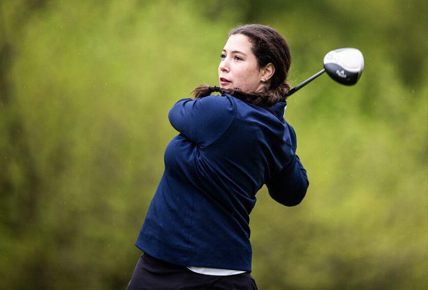 Poly Prep Golf team Athlete swings the golf club